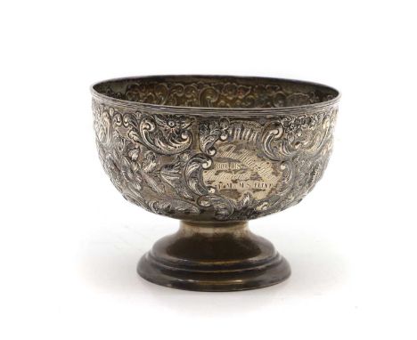 A silver pedestal bowl by George Nathan &amp; Ridley Hayes, 1897, with embossed decoration and engraved cartouche,16cm diamet