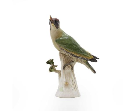 A Meissen porcelain model of a green woodpecker, 19th century, German, painted in enamel colours and gilt, with black open be