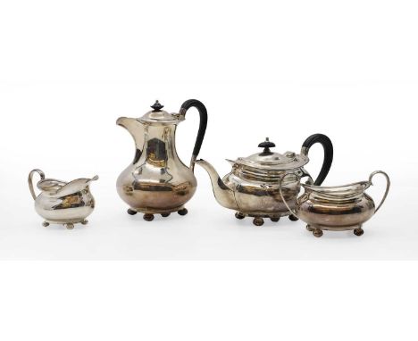 A silver tea service by Atkin Brothers, 1952, teapot 28cm wide, hot water pot, 22cm tall, creamer 14cm wide, sugar bowl 17.5c