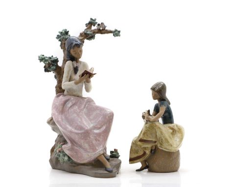 Two Lladro figures, modern, a girl seated beneath a tree reading a book, numbered '2231', 38cm high, and a girl with a cat, n