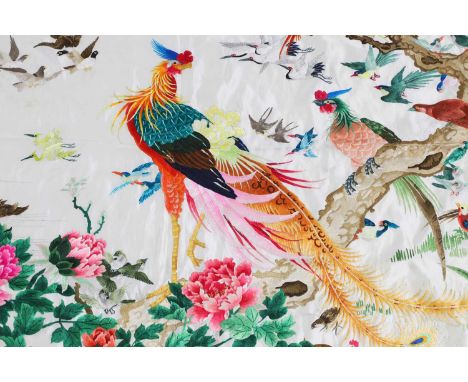 A Chinese embroidered panel, 20th century, decorated with phoneixes surrounded by various kinds of birds among peony and pine