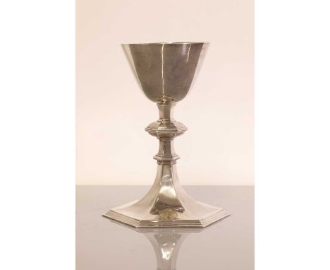 A George VI ecclesiastical silver chalice, by Howard Jesse Brown,the tapering bowl raised on an hexagonal knopped stem, termi