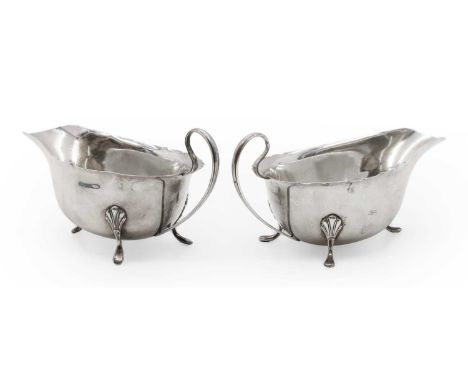 A pair of silver sauce boats by William Neale &amp; Son, Birmingham 1902, of typical form with pie crust edges,15cm wide 6.4o