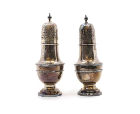 A pair of silver sugar castors by Harrison Brothers &amp; Howson, Sheffield 1900 and 1923, of typical form with urn finials,2
