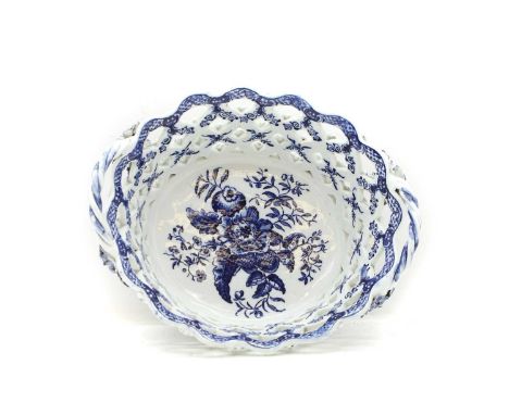 A Lowestoft blue and white porcelain basket  c.1775-85, of oval form, the central reserve printed in underglaze blue with pin