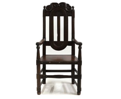 An oak side chair 17th century and later, 56cm wide 46cm deep114cm high, seat 43cmCondition ReportWobbly - later seat.