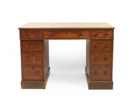 A Victorian mahogany pedestal desk, the lined top above arrangement of nine drawers on plinth base112cm wide  66cm deep 74.5c