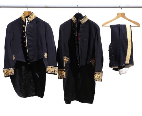 An officers dress coat and trousers  the dark navy suit with gold braid detail, the jacket inscribed Sir Fredrick Phillips KC