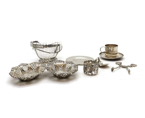 A Victorian silver cup and saucer London 1893,the cup with half reeded body,together with a pair of pirced sweetmeat dishes,B