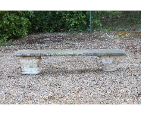 A stone bench,  rectangular seat on matched capital supports 153cm wide 44.5cm deep 36cm highProvenance: The Estate of the La