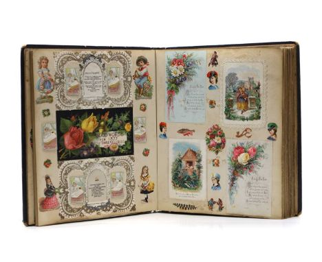 A Victorian scrap album with approximately 48 filled pages, including embossed and paper lace examples, with early Christmas 