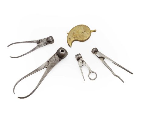 A twelve bore scissor mould together with three iron revolver moulds and a brass loading pouch for percussion pistols (5)Ship
