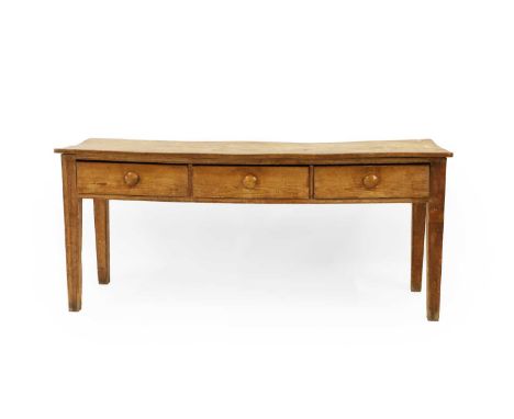 An elm and pine side table, 19th century, with three short drawers, terminating in tapering legs, 181cm wide  58cm deep 59cm 