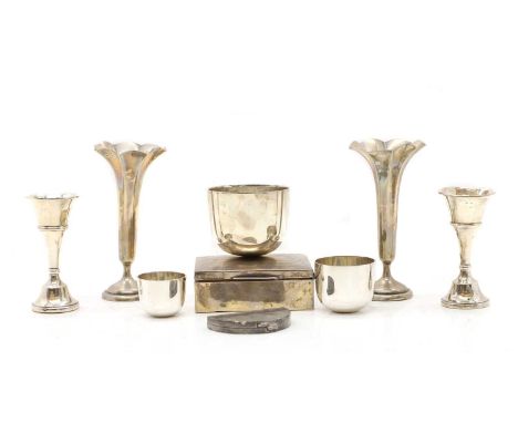 A pair of silver bud vases, Birmingham 1961, of trumpet form, 11cm high, together with one other pair of bud vases, weighted 