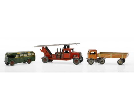 A group of die-cast toys comprising a 1950s fire engine with firemen, the tyres marked 'Dunlop 90', a Wells-Brimtoy Green Lin