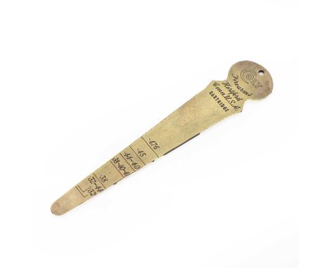A Colt brass calibre gauge  of tapering form with numbered markings 10.5cm longShipping Disclaimer  Buyers must be aware of t