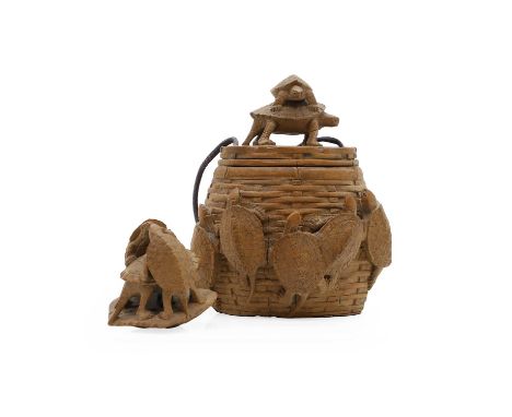 An amusing Japanese wood tonkotsu, signed Mitsukado, signed twice, Meji Period, modelled as a basket crawling with terrapins,