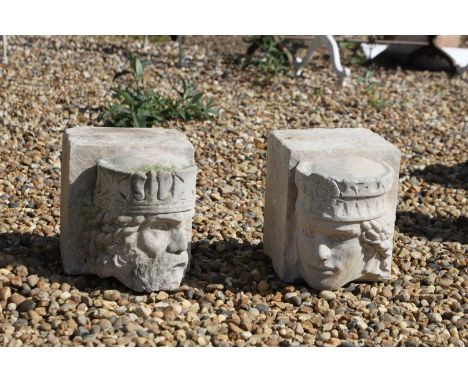 A pair of cast stone corbels, depicting a king or queen, 21cm wide31cm deep23cm high (2)Condition ReportChips to the corners.