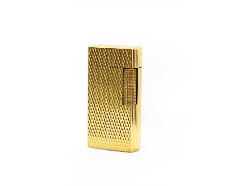 A Dunhill gold-plated cigarette lighter with engine turned decoration, in original Dunhill box, with complimentary slip, 3cm 