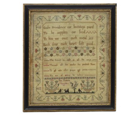 A Regency needlework sampler signed Jane Roberts and dated November 5 1811, worked in silks on linen ground with verse and pi