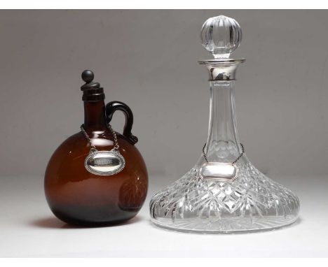 A modern silver ship decanter, with a silver label, 27cm high, and an amber glass bottle, 20cm high, with a silver plated 'Po