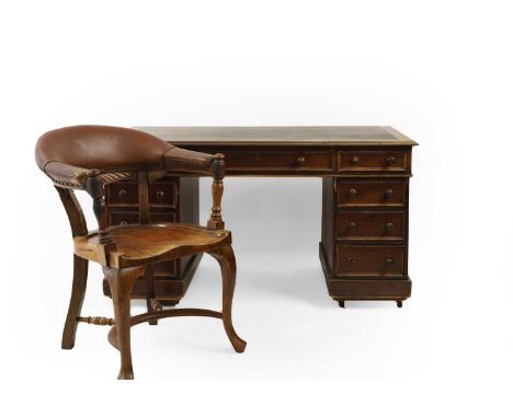 A Victorian mahogany pedestal desk, 135cm wide  72cm deep 74cm high, and a desk chair,with brown leatherette upholstery, 62cm