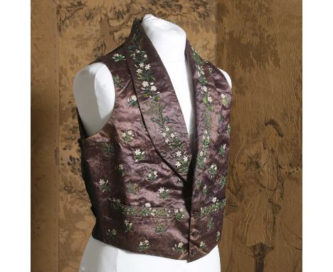 A gentlemen's silk waistcoat, mid 19th century, cut in brown silk, embroidered with foliate and floral motifs in tones of gre