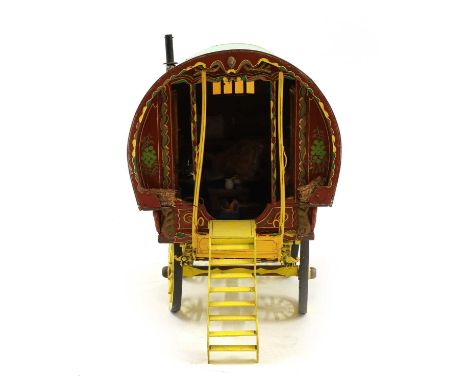 A painted gypsy wagon 20th century, 78cm long68.5cm high, together with various items, a ladder, doll and kettle (qty)