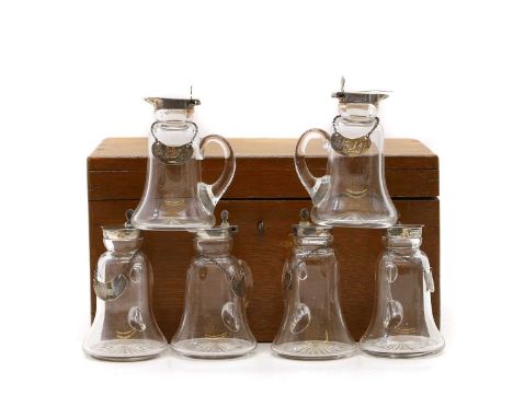 A set of six cased silver topped whiskey noggins by Huskin &amp; Heath Ltd, Birmingham 1922, each with Whisky bin label, in f