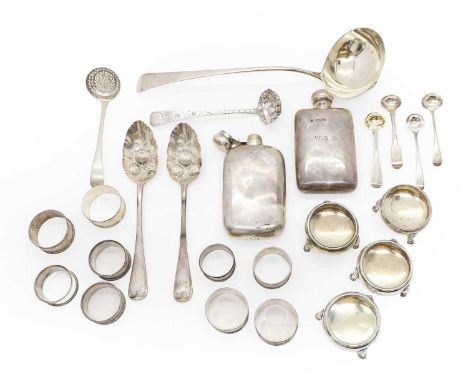 A collection of silver items to include a composed pair of berry spoons, 22cm long, one marked London 1824, the other London 