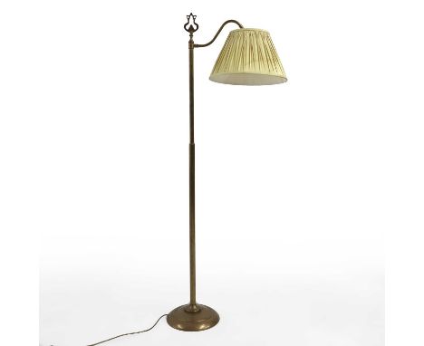 A brass floor-standing reading lamp 20th century, with an arched arm, complete with a cream silk pleated shade149cm highCondi