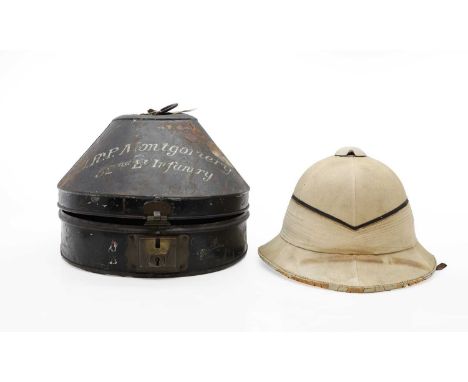 A pith helmet  contained in a bespoke toleware case, inscribed J R P Montgomery, 52nd Light Infantry case 36cm longProvenance