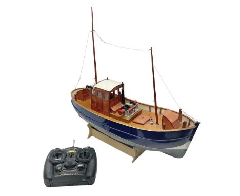 Model two masted fishing boat, on wooden stand, with a HiTec Ranger II N remote control, untested