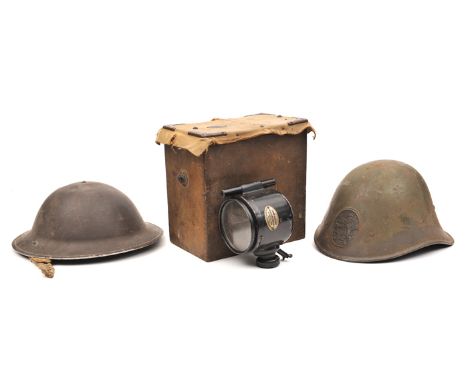 A WWII period Dutch steel helmet, the front with embossed oval rampant lion badge, with lining and chinstrap, GC (requires cl