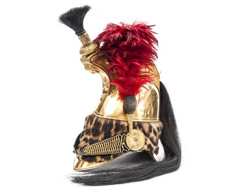 †A very good French dragoon officer’s helmet,  c 1840-1845, gilt skull with leopard skin turban, tall comb, the side profusel