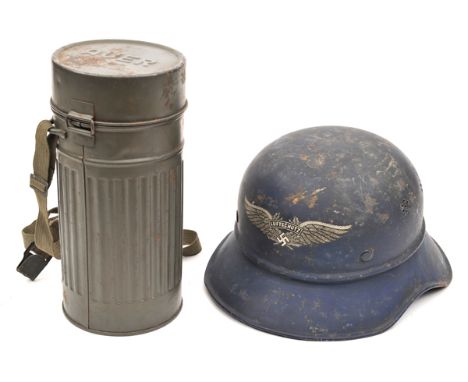 †A German WWII Luftschutz steel helmet, with “Luftschutze” transfer to front and transfer label inside the neck guard, with l