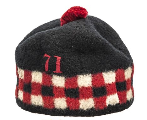 A rare other rank’s “Hummel” bonnet of The 71st (Highland) (Light Infantry) c 1830, of stitched padded blue cloth, with chequ