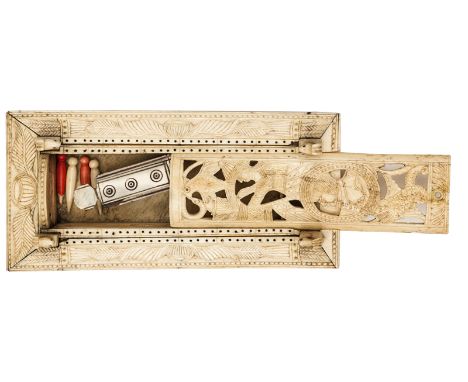 A French Napoleonic prisoner of war carved bone games box,  the top panels carved with foliate pattern and pierced for cribba