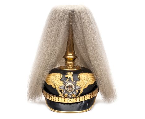 †A fine Prussian M1895 Garde Infantry Reservist officer’s parade pickelhaube, fully gilt mounted, the eagle plate with silver