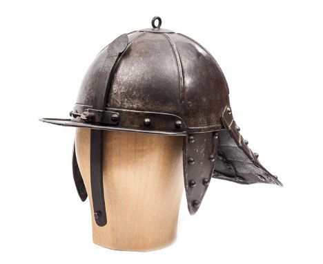 A good heavy mid 17th century Dutch lobster tail helmet, the skull formed in two pieces with six radiating ribs and loop at t