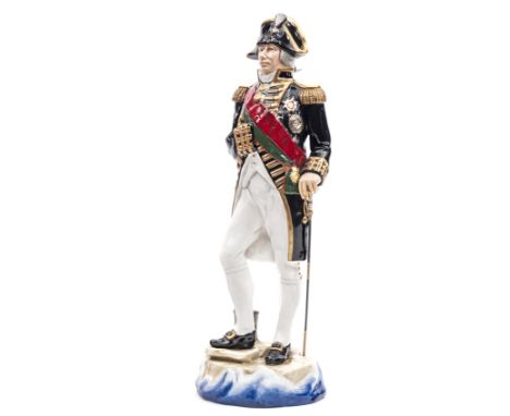 A Michael Sutty large painted porcelain figure “Lord Nelson 1805”  in full dress with bicorne hat, scarlet sash, blue coat, l