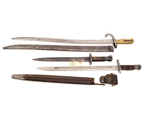 A Chassepot bayonet in scabbard, a US M1913 bayonet in scabbard and another. QGC to GC (3)  