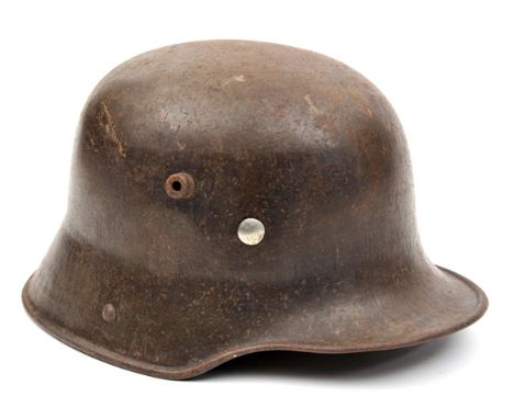 The skull only of a German M16 steel helmet,  with some original dark grey/green finish, and traces of decals. GC (some light