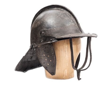 A Cromwellian triple  bar “lobster tail” helmet, the skull in two halves with low medial rib and engraved with single line; t