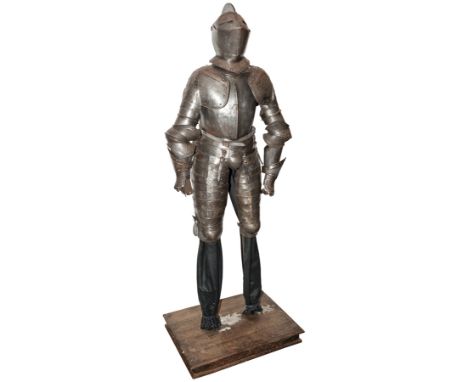 A composite suit of light field armour in the mid 16th century Italian style, comprising close helmet with hinged visor, brea