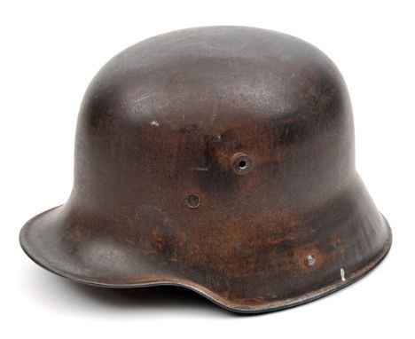A German M16 steel helmet, with original padded leather lining and chinstrap. GC (bare, lightly pitted finish to skull, chins