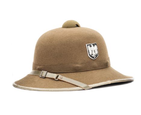 †A good WWII German Afrika Korps tropical helmet, dark khaki with grey leather trim and metal shield badges, the leather swea