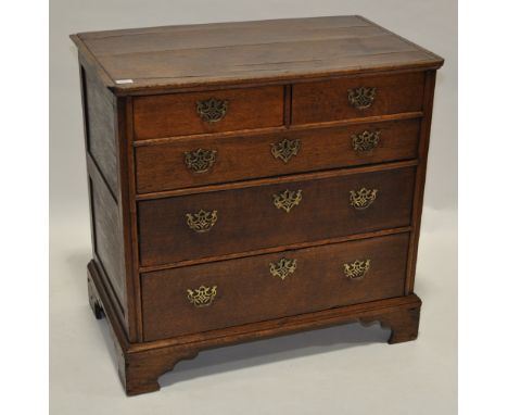 An Antique oak chest of 2 short and 3 long drawers,brass drop handles raised on bracket feet of small size, width 3', height 