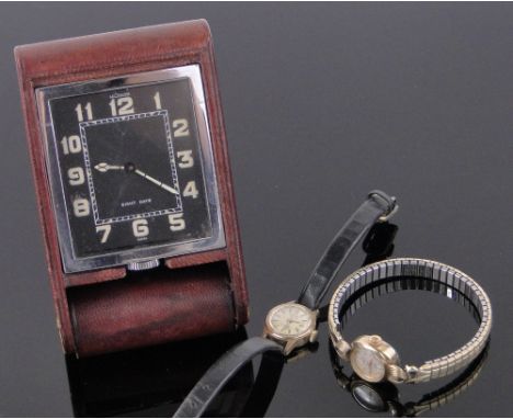 A Le-Coultre leather cased 8-day travelling clock,black dial with luminous numerals, case width 6.5cm together with a lady's 