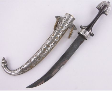 An Arab Jambiya dagger,with ornate brass and white metal overlay scabbard, blade length 9", length overall 16".